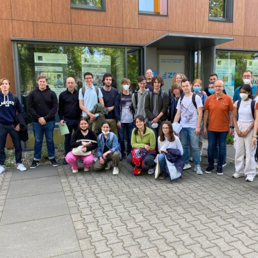 A school class group photo in front of the ZBT in Duisburg.