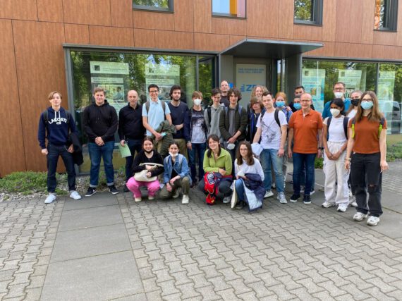 A school class group photo in front of the ZBT in Duisburg.